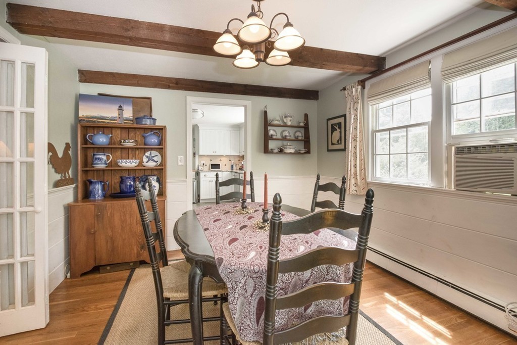 7 Jackson Road Scituate, MA 02066 - Photo 9 of 24 a view of a dining room with furniture and a chandelier