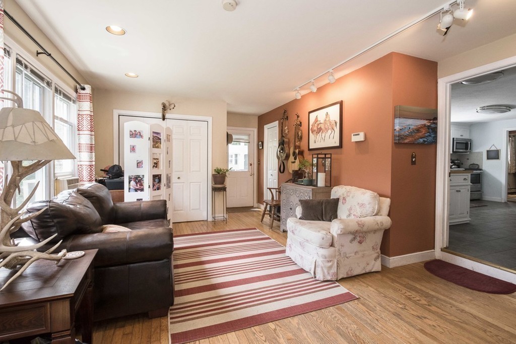 7 Jackson Road Scituate, MA 02066 - Photo 10 of 24 a living room with furniture and a fireplace