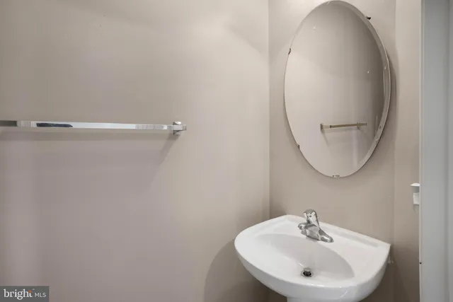 a bathroom with a sink a mirror and a shower