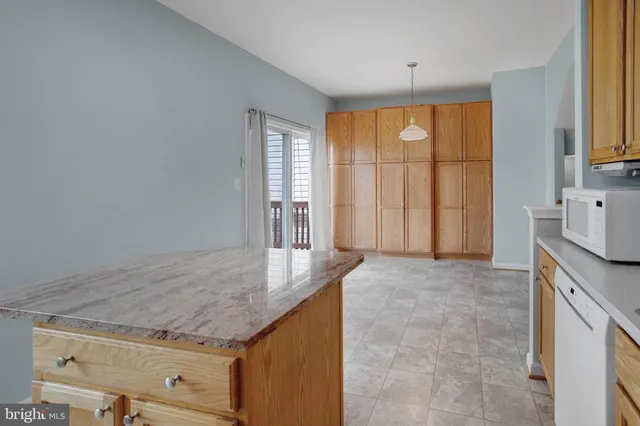 a living room with granite countertop furniture and a window