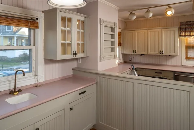 a kitchen with a sink and cabinets