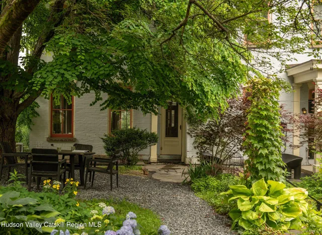 a view of a tree in a yard