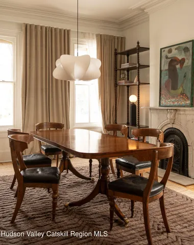 a view of a dining room with furniture and window