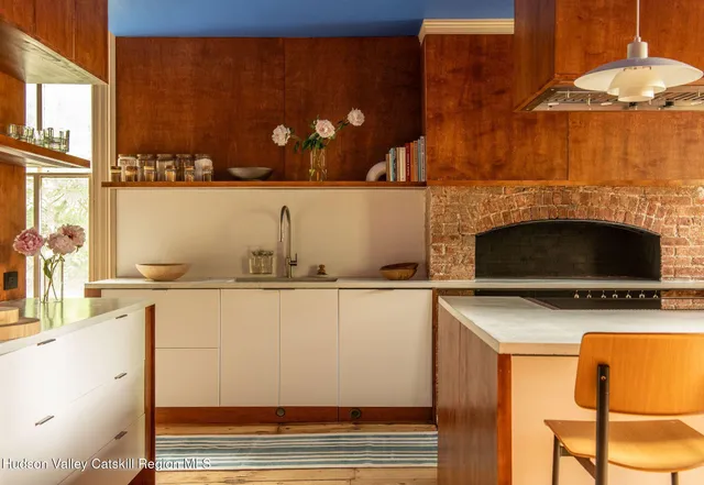a view of a kitchen with a sink and cabinets