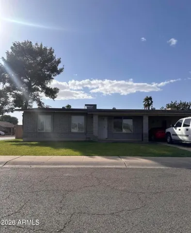 a view of swimming pool with outdoor seating and yard in back