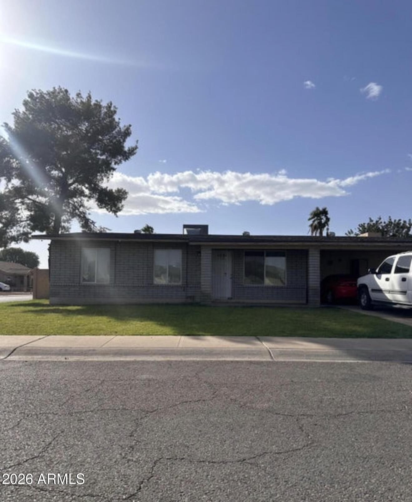 2916 North 87th Lane Phoenix, AZ 85037 - Photo 2 of 16 a view of swimming pool with outdoor seating and yard in back