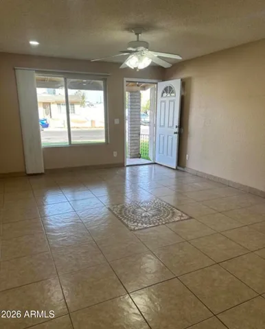 a view of an empty room with a window