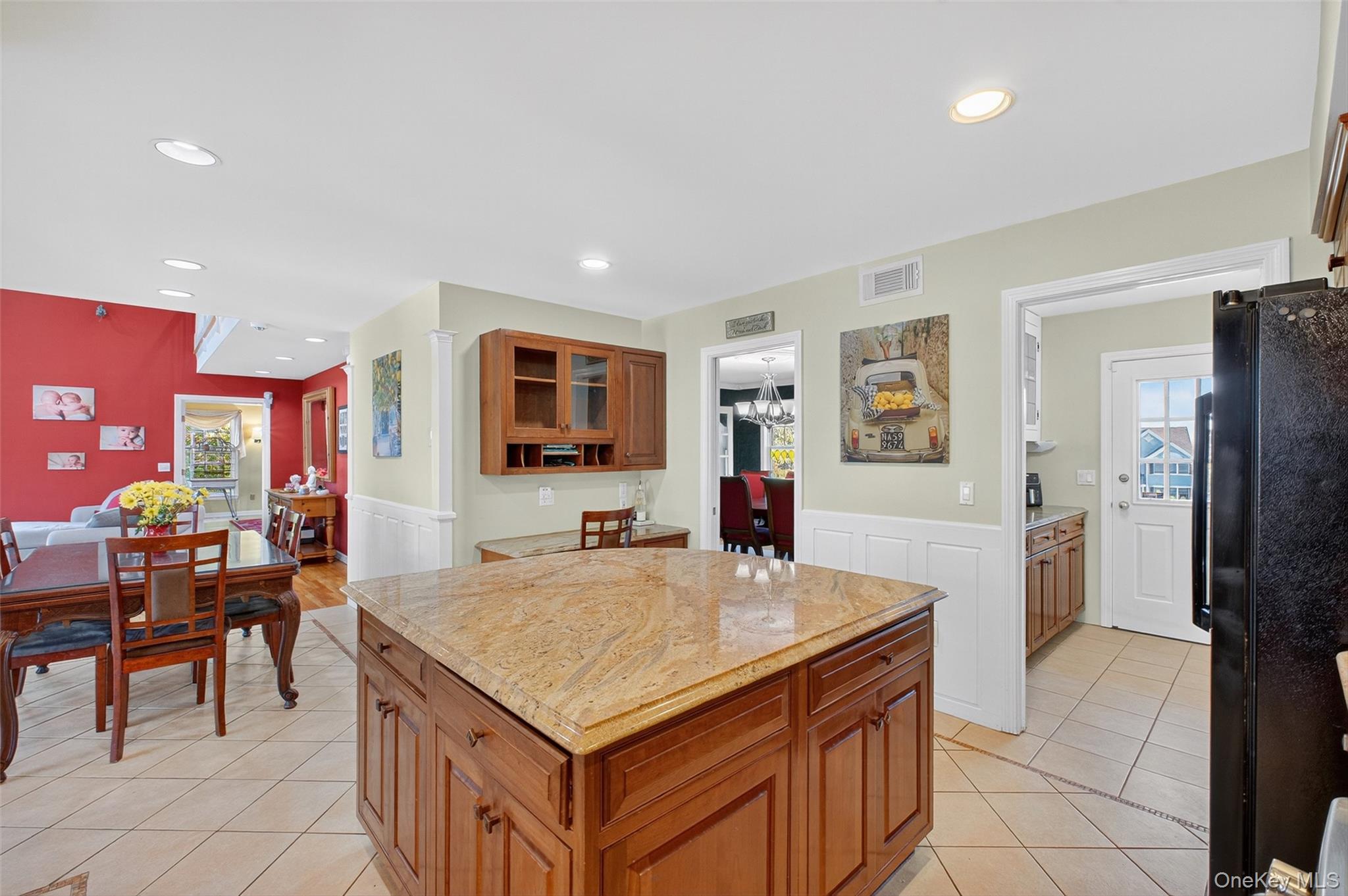 8 Cale Road Amawalk, NY 10501 - Photo 12 of 47 a living room with stainless steel appliances kitchen island granite countertop a table and chairs in it