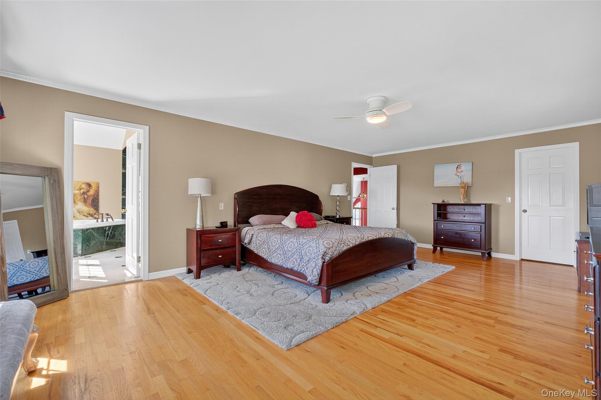 8 Cale Road Amawalk, NY 10501 - Photo 19 of 47 a spacious bedroom with a bed and wooden floor