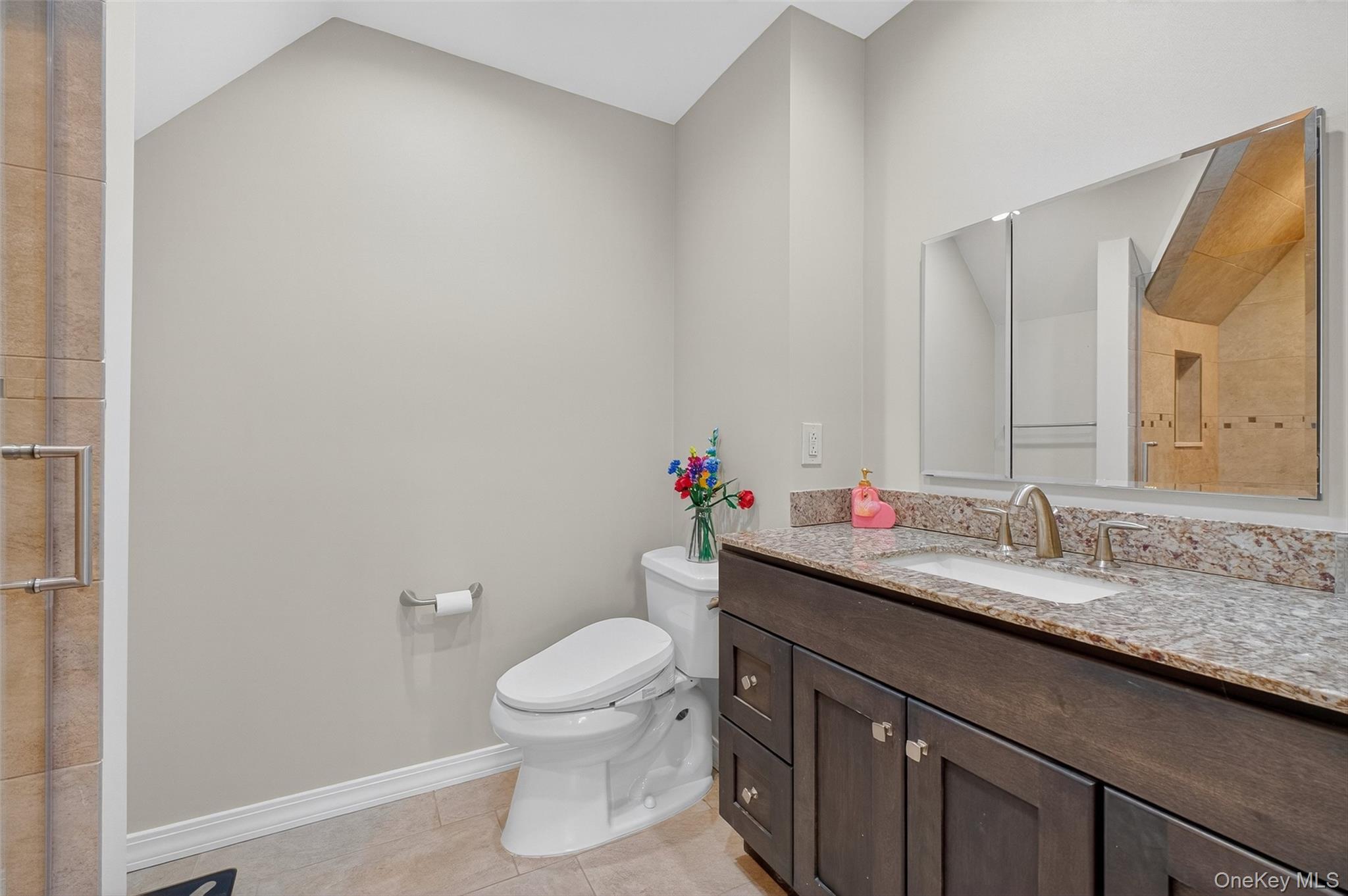 8 Cale Road Amawalk, NY 10501 - Photo 26 of 47 a bathroom with a granite countertop sink a toilet and a mirror