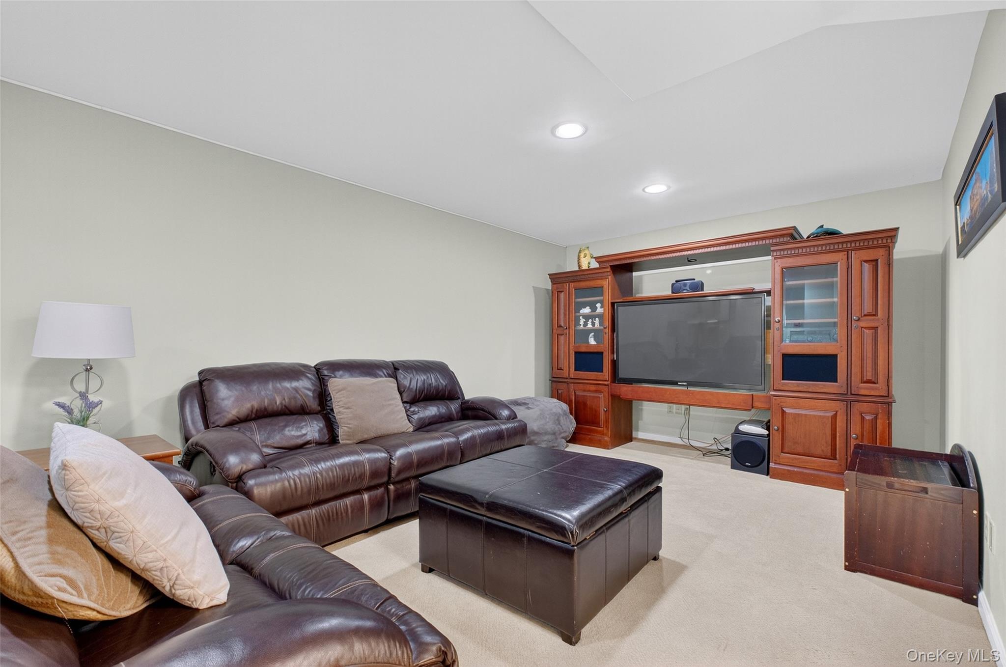 8 Cale Road Amawalk, NY 10501 - Photo 28 of 47 a living room with furniture and a flat screen tv