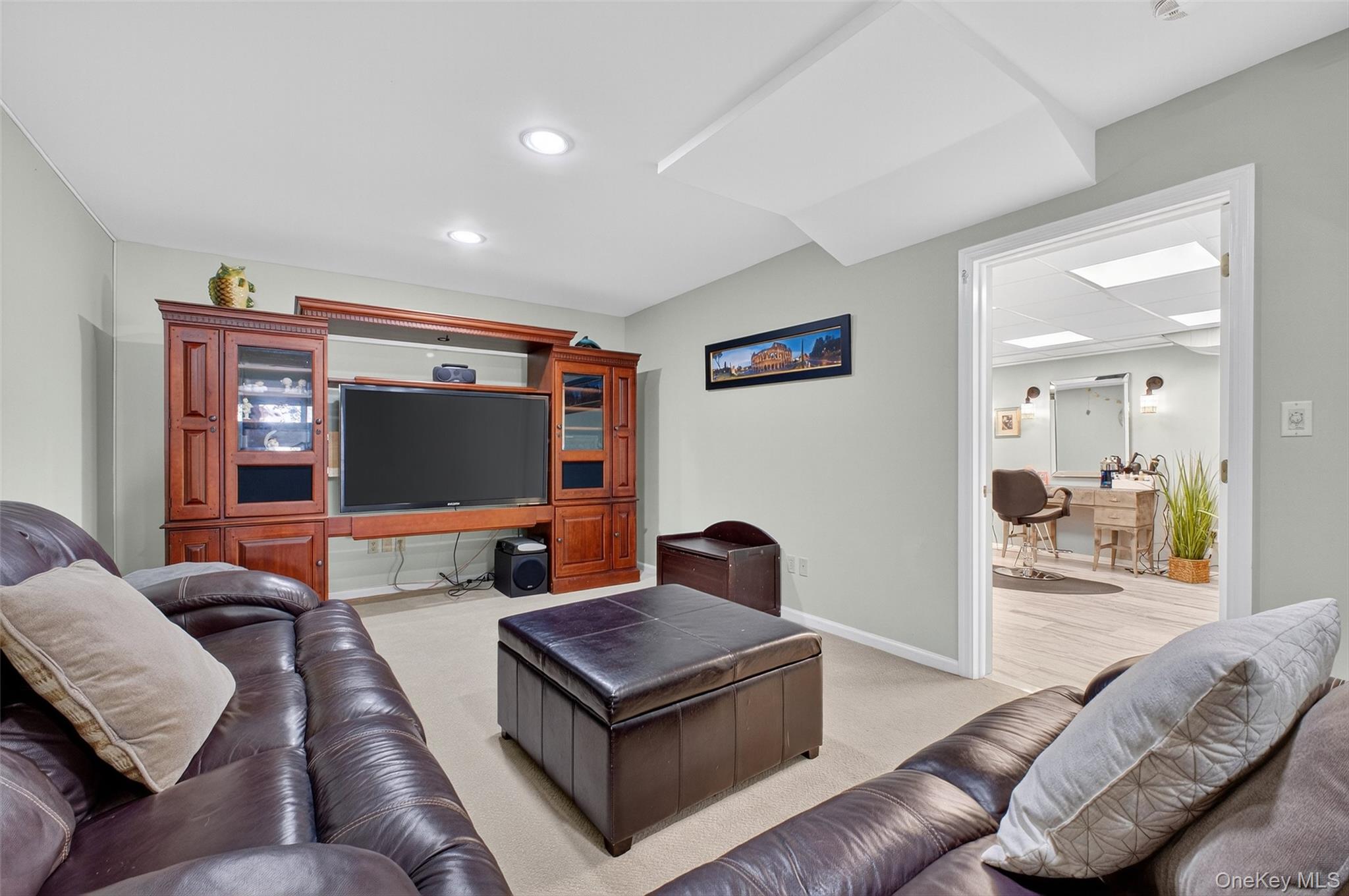 8 Cale Road Amawalk, NY 10501 - Photo 29 of 47 a living room with furniture and a flat screen tv