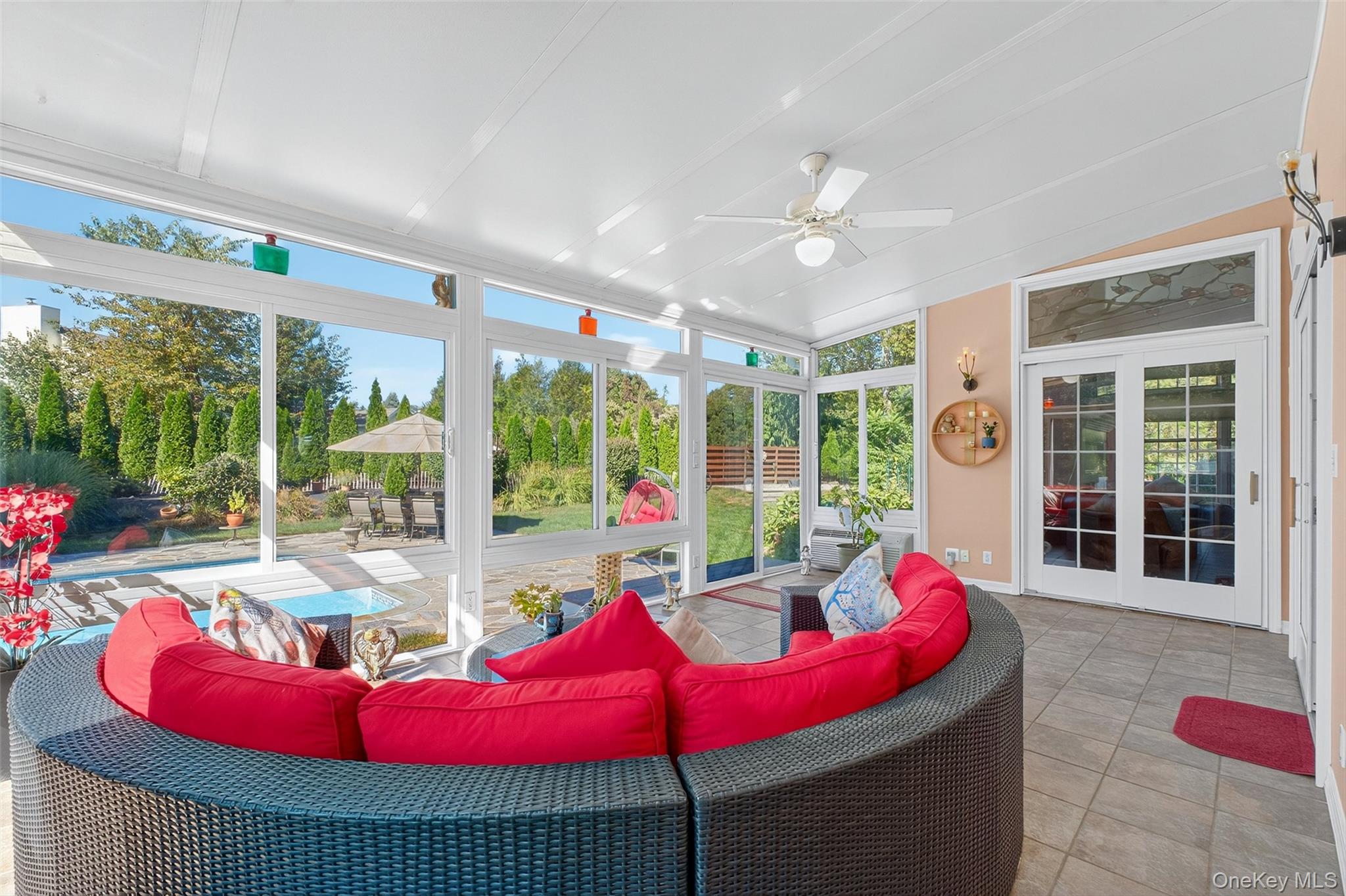 8 Cale Road Amawalk, NY 10501 - Photo 33 of 47 a living room with furniture and a floor to ceiling window