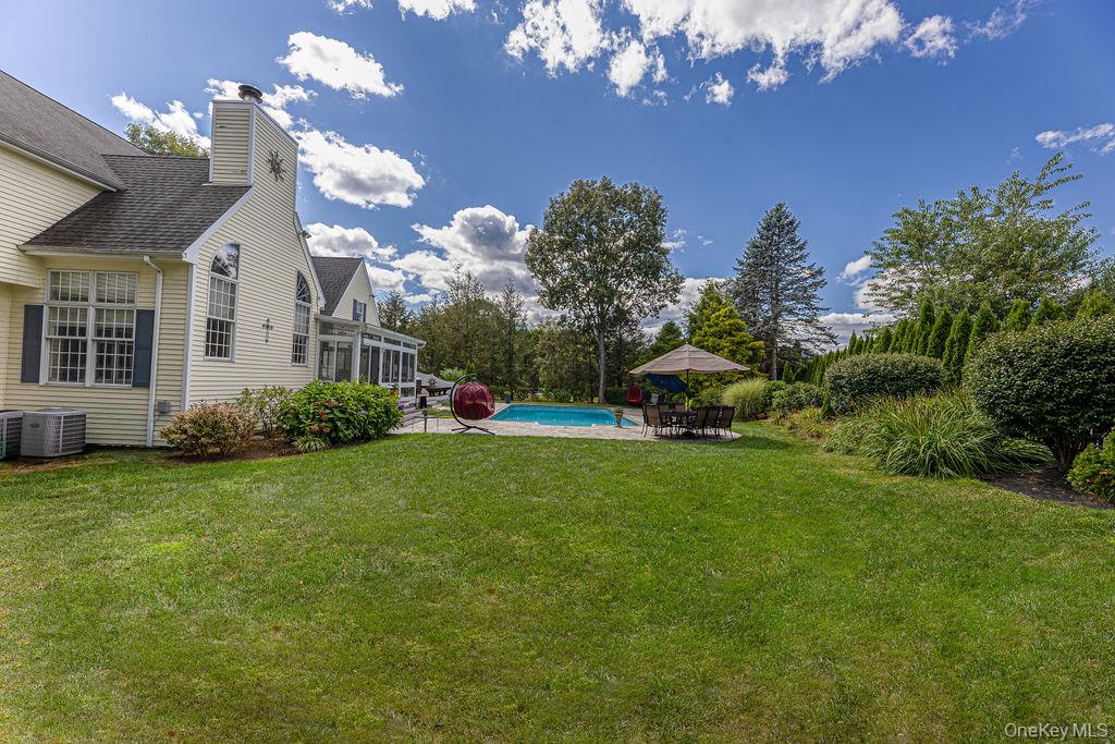 8 Cale Road Amawalk, NY 10501 - Photo 41 of 47 a front view of a house with garden