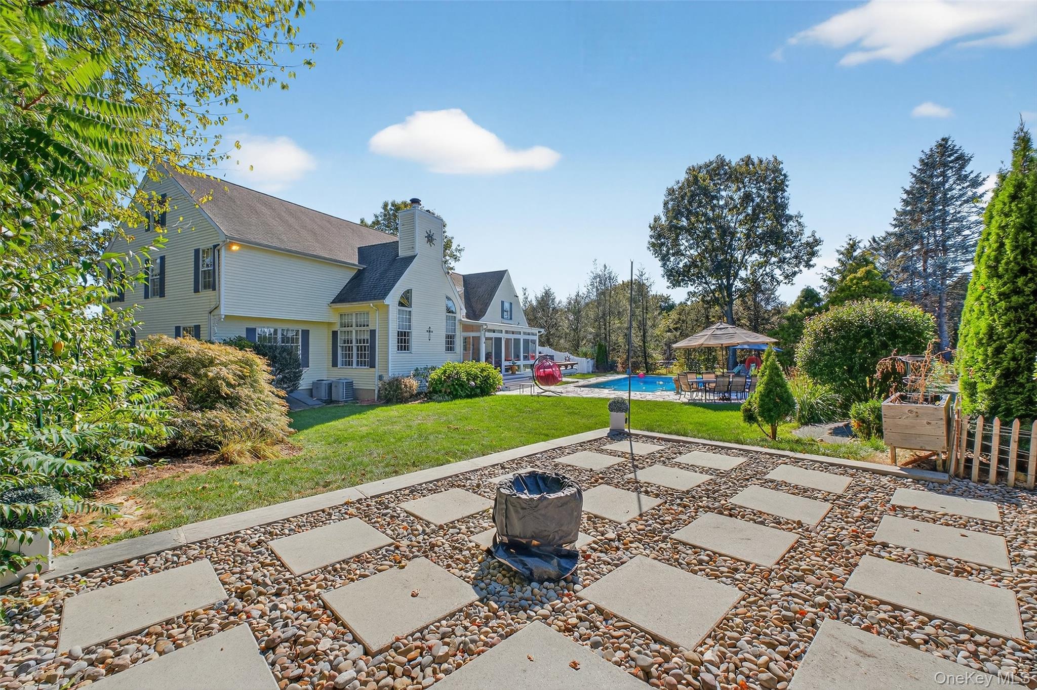8 Cale Road Amawalk, NY 10501 - Photo 44 of 47 a house with garden in front of it
