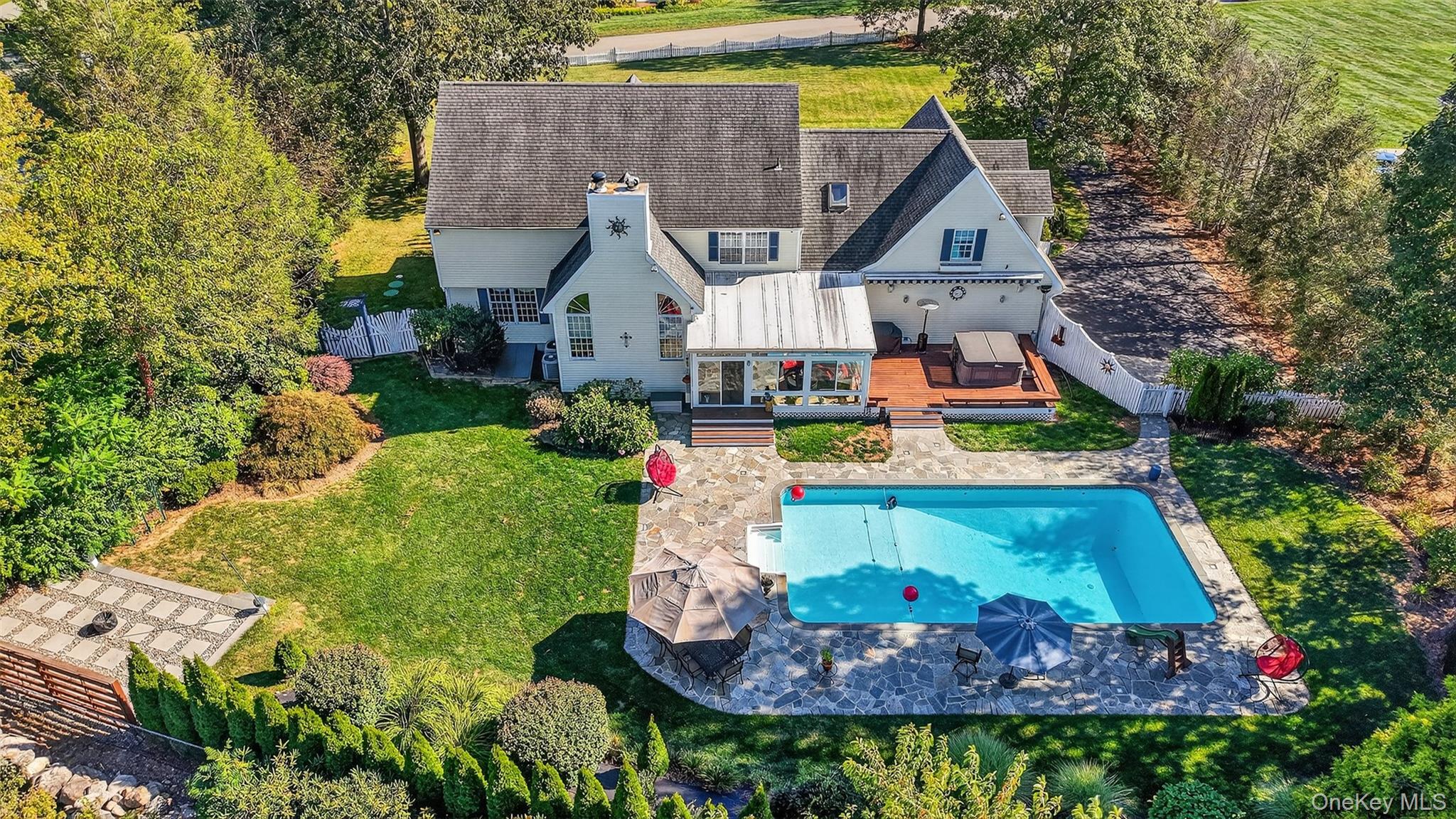 8 Cale Road Amawalk, NY 10501 - Photo 46 of 47 a view of a house with a yard and potted plants