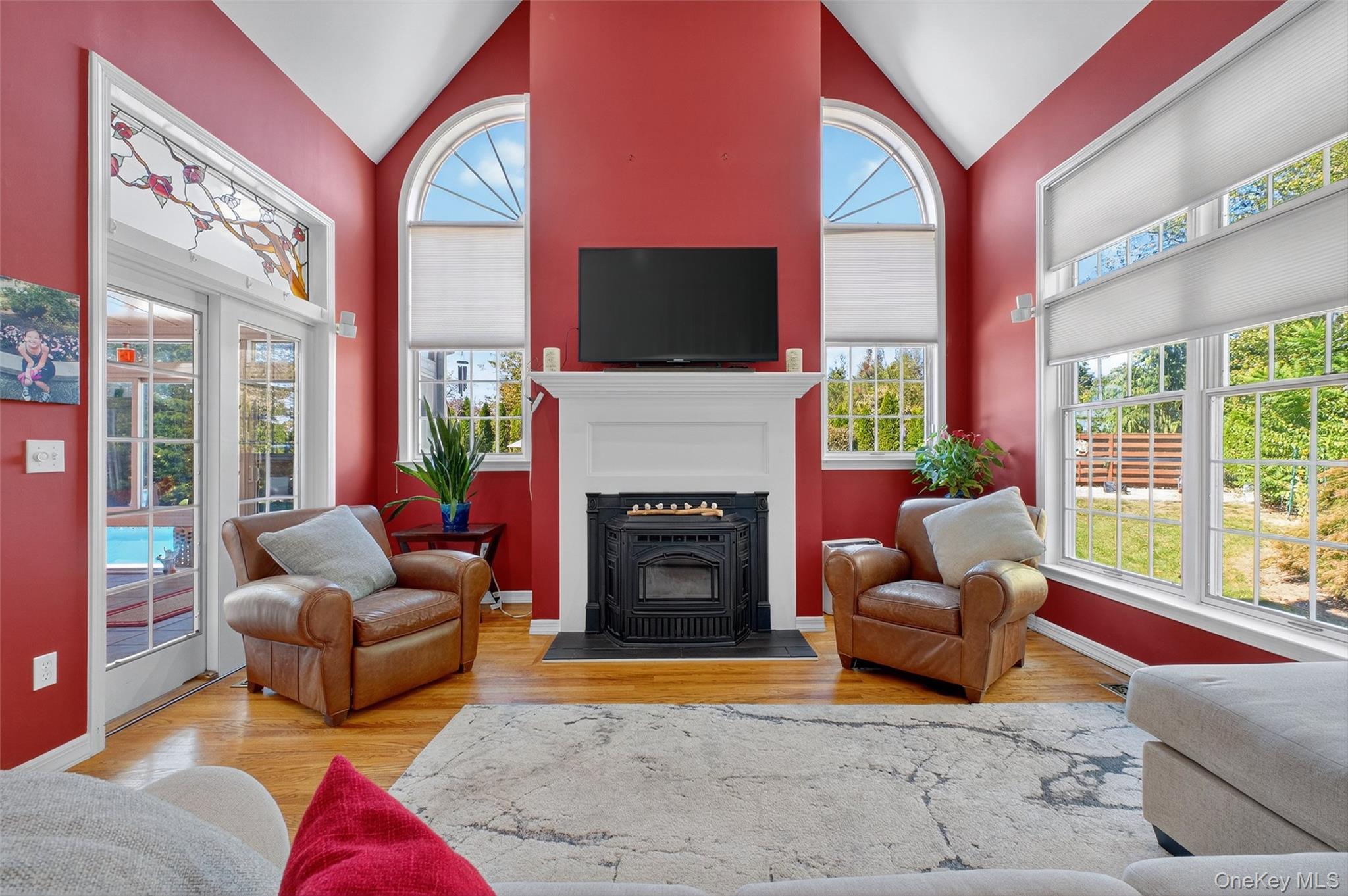 8 Cale Road Amawalk, NY 10501 - Photo 8 of 47 a living room with furniture a flat screen tv and a fireplace