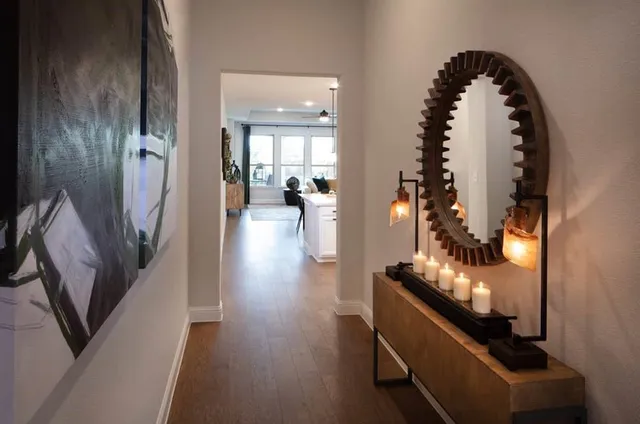 a view of a workspace with furniture and a bookshelf