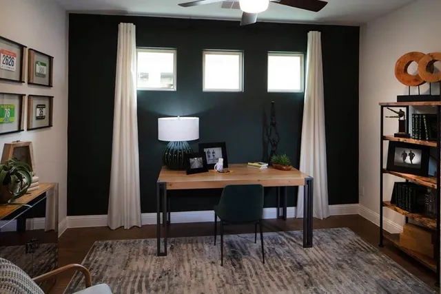 a kitchen with stainless steel appliances kitchen island granite countertop a stove a sink a refrigerator and a dining table with wooden floor