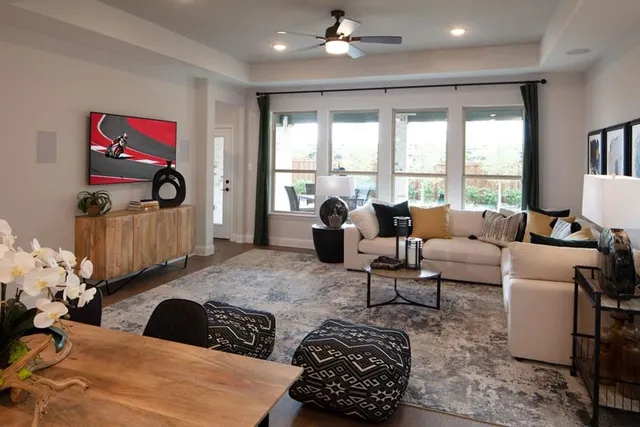 a kitchen with stainless steel appliances kitchen island granite countertop a kitchen island a stove a table and chairs in it