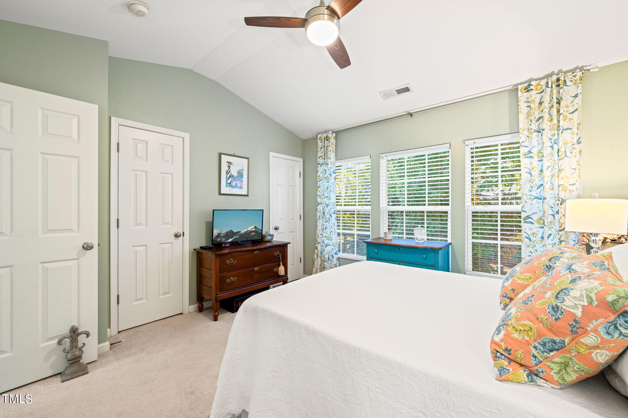 1708 Sorrell Brook Way Raleigh, NC 27609 - Photo 15 of 36 a bedroom with a bed and a large window