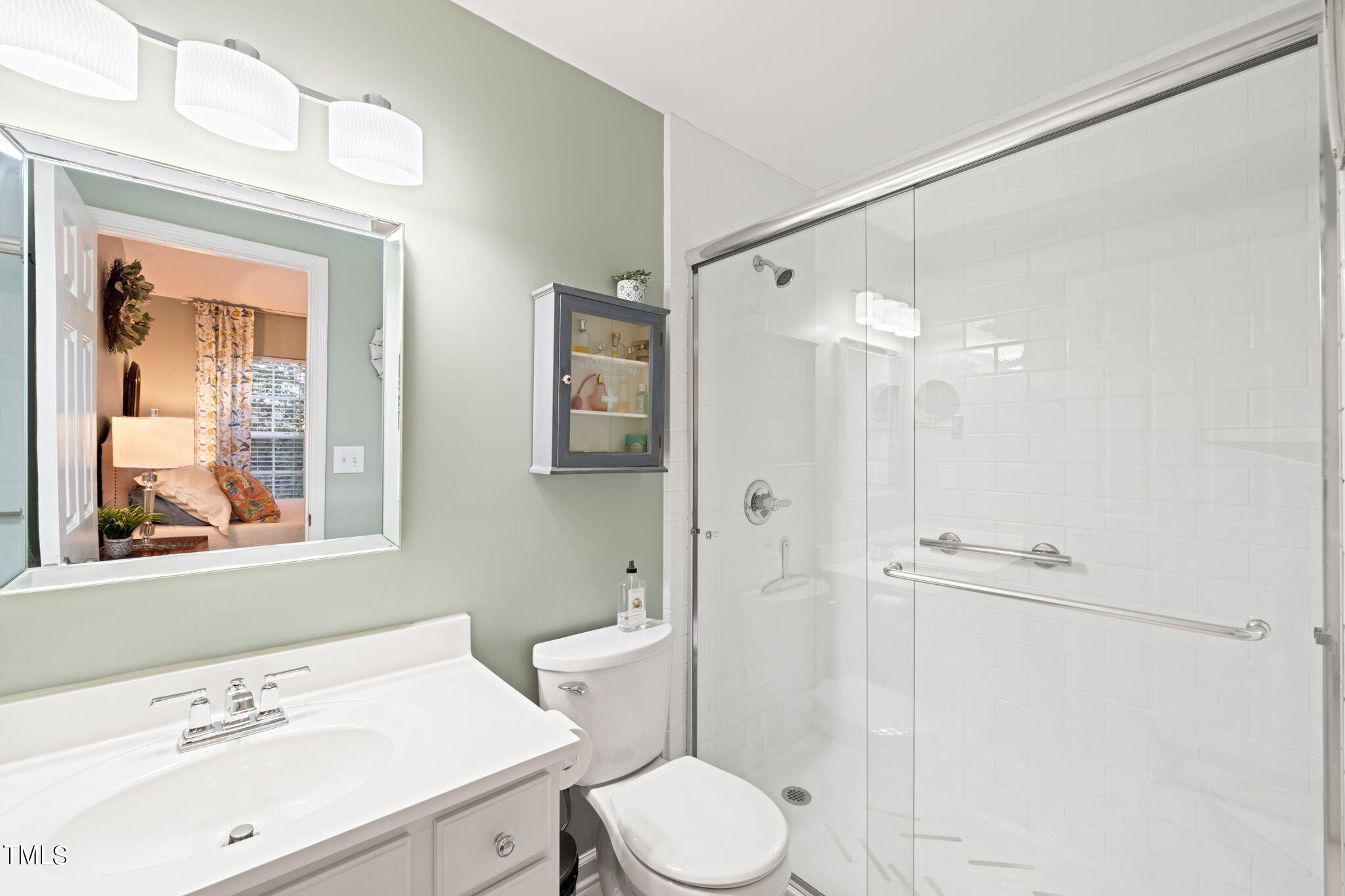 1708 Sorrell Brook Way Raleigh, NC 27609 - Photo 16 of 36 a bathroom with a sink a toilet and shower