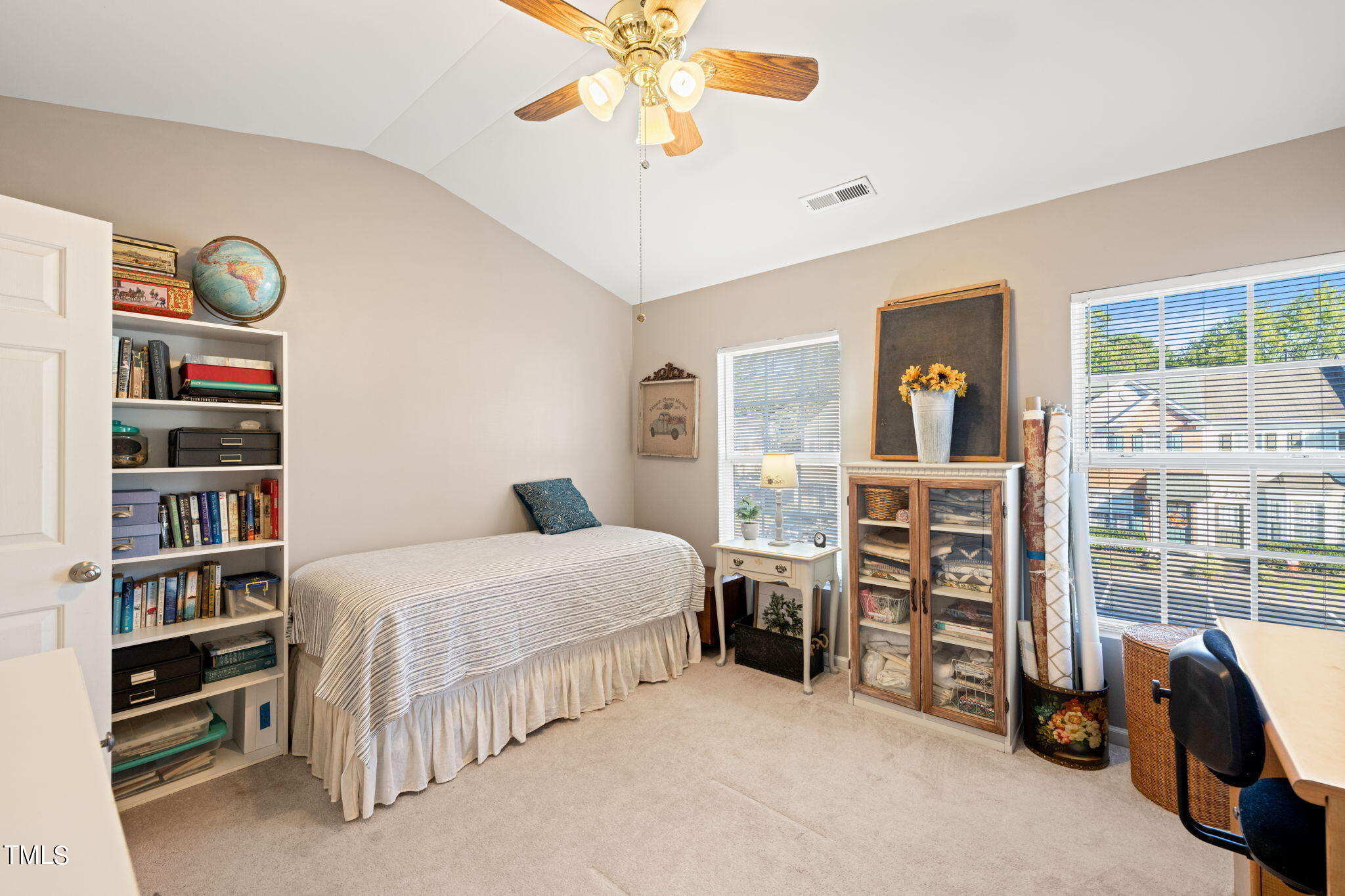 1708 Sorrell Brook Way Raleigh, NC 27609 - Photo 17 of 36 a bedroom with bed and a book shelf