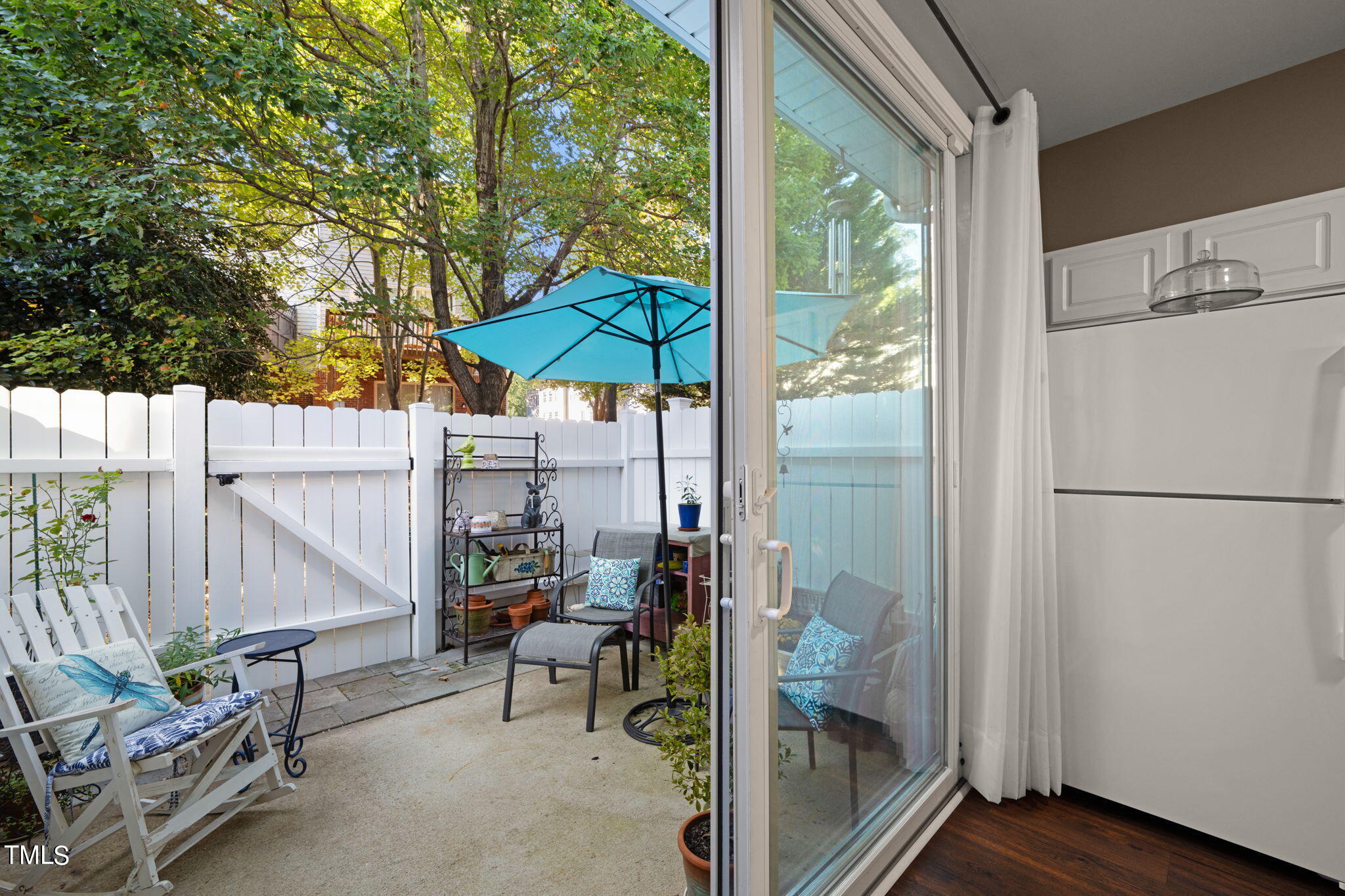 1708 Sorrell Brook Way Raleigh, NC 27609 - Photo 22 of 36 a view of a balcony with chairs and an umbrella