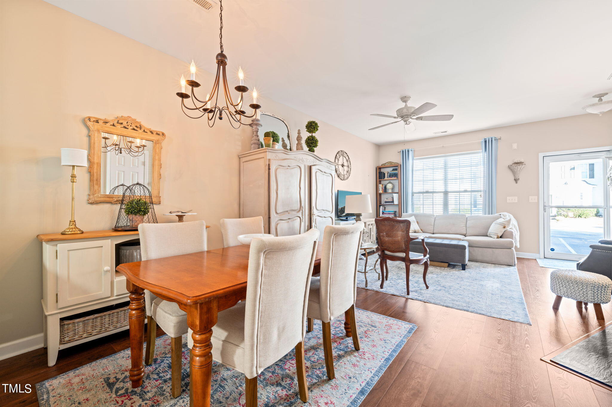 1708 Sorrell Brook Way Raleigh, NC 27609 - Photo 5 of 36 a view of a dining room with furniture window and wooden floor