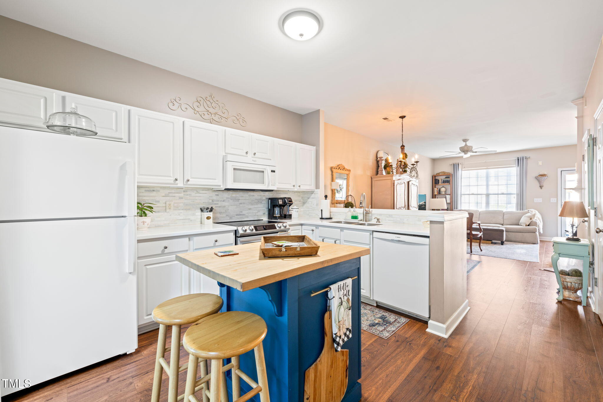 1708 Sorrell Brook Way Raleigh, NC 27609 - Photo 8 of 36 a kitchen with stainless steel appliances a stove a sink dishwasher and a refrigerator