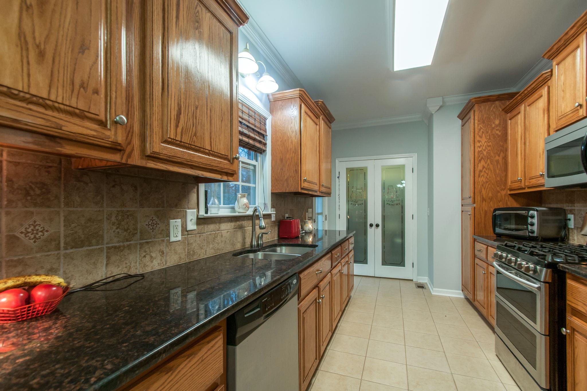 1452 White Bluff Road White Bluff, TN 37187 - Photo 10 of 28 Kitchen leads to a huge pantry. Washer and dryer hook ups in case you wanted to move the laundry to the main floor.