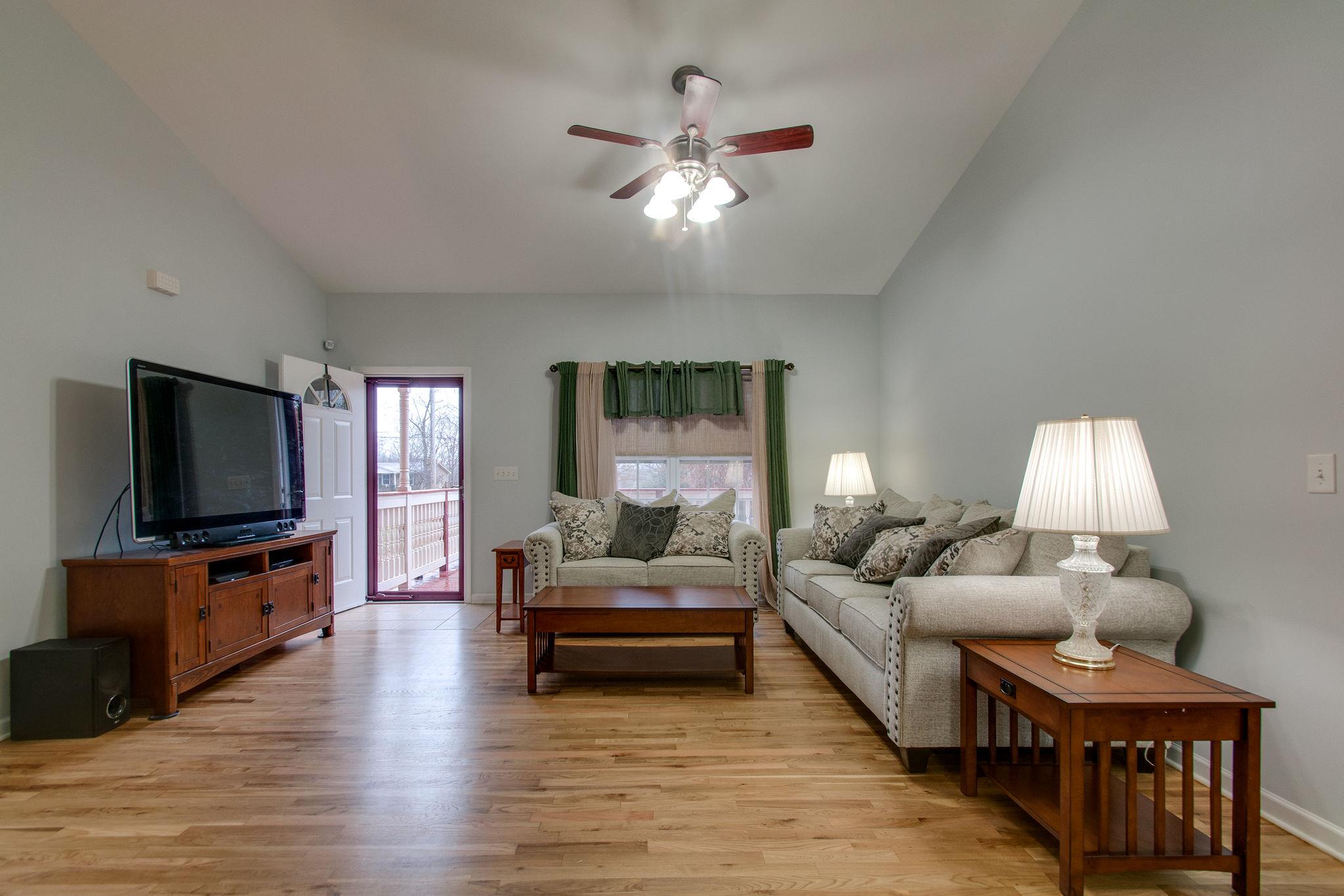 1452 White Bluff Road White Bluff, TN 37187 - Photo 6 of 28 Newly refinished floors and fresh paint. Vaulted ceiling give this room an open feel.