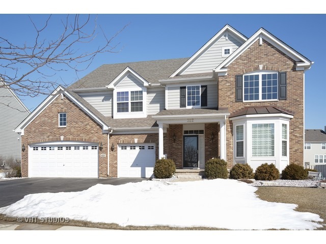 322 Monument Road Elgin, IL 60124 - Photo 1 of 15 a front view of a house with a yard