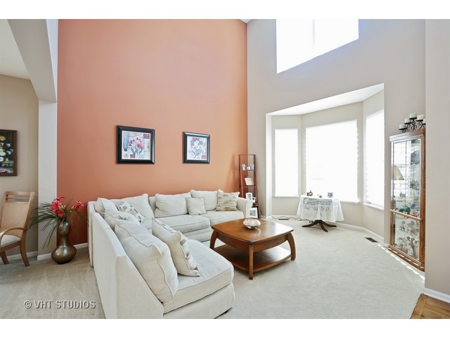 322 Monument Road Elgin, IL 60124 - Photo 2 of 15 a living room with furniture and a large window