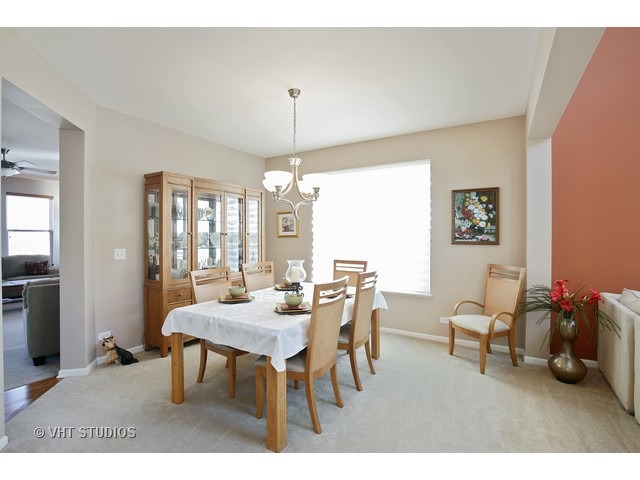 322 Monument Road Elgin, IL 60124 - Photo 7 of 15 a view of a dining room with furniture and chandelier