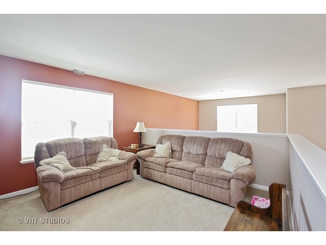 322 Monument Road Elgin, IL 60124 - Photo 10 of 15 a living room with furniture and a couch