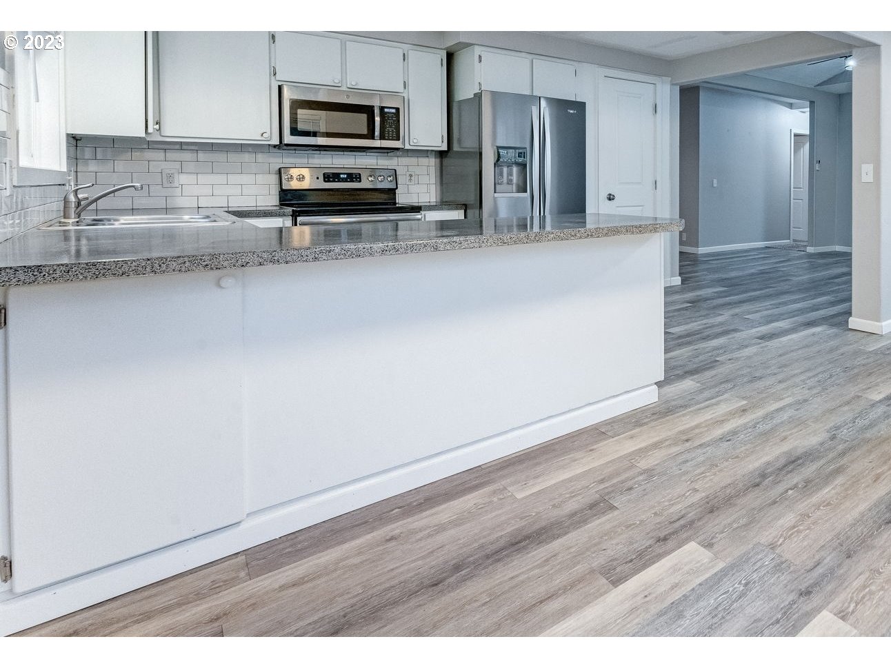 24505 Northeast Dresser Road Camas, WA 98607 - Photo 12 of 34 a view of a kitchen with wooden floor