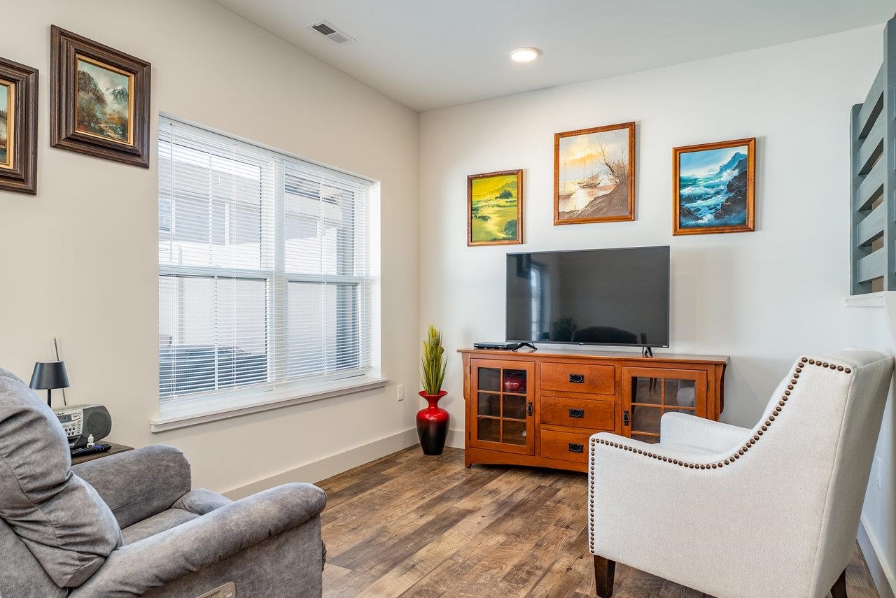 30 Field Court Bridgewater, VA 22812 - Photo 29 of 65 a living room with furniture a flat screen tv and a window