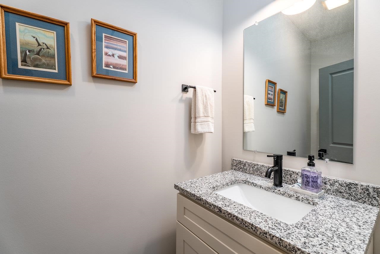 30 Field Court Bridgewater, VA 22812 - Photo 32 of 65 a bathroom with a granite countertop sink and a mirror
