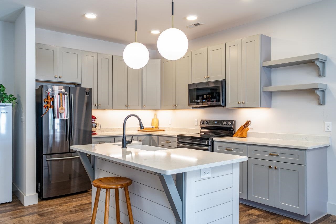 30 Field Court Bridgewater, VA 22812 - Photo 6 of 65 a kitchen with stainless steel appliances granite countertop a sink a stove and a refrigerator