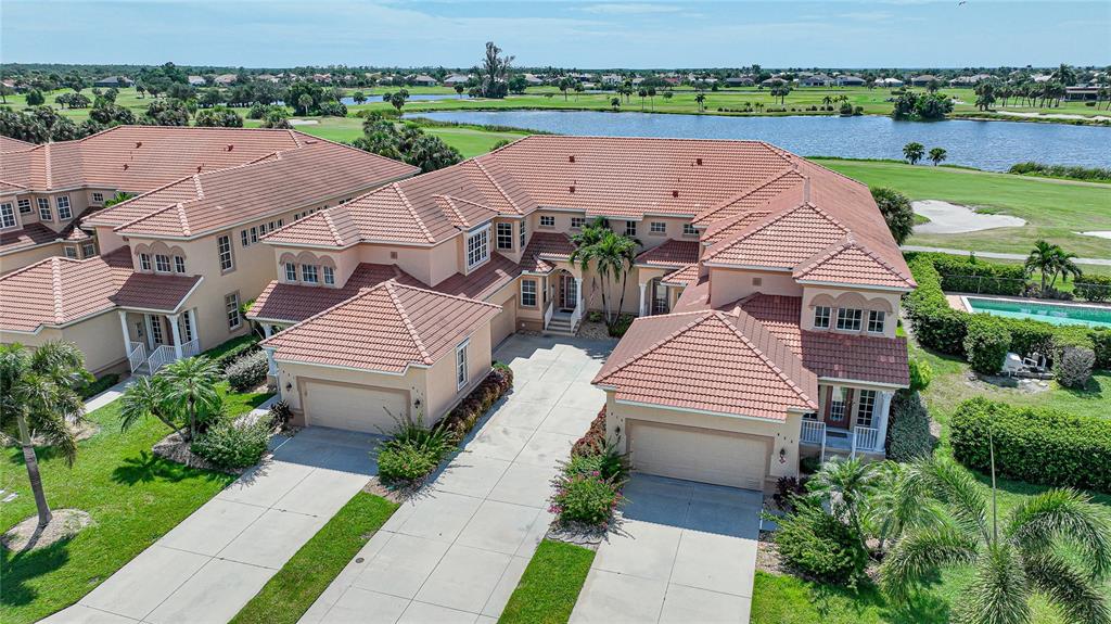 3959 San Rocco Court, Unit 911 Punta Gorda, FL 33950 - Photo 38 of 85 an aerial view of a house with garden space and lake view
