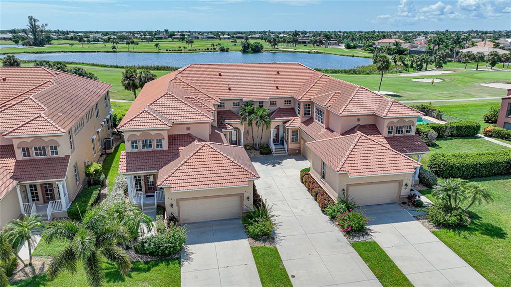 3959 San Rocco Court, Unit 911 Punta Gorda, FL 33950 - Photo 41 of 85 an aerial view of a house with garden space and street view