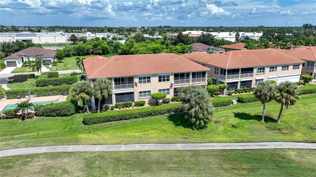 3959 San Rocco Court, Unit 911 Punta Gorda, FL 33950 - Photo 43 of 85 a front view of a house with a garden