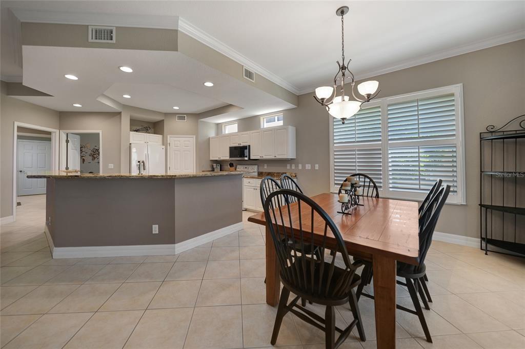 3959 San Rocco Court, Unit 911 Punta Gorda, FL 33950 - Photo 54 of 85 a view of a dining room with furniture and window
