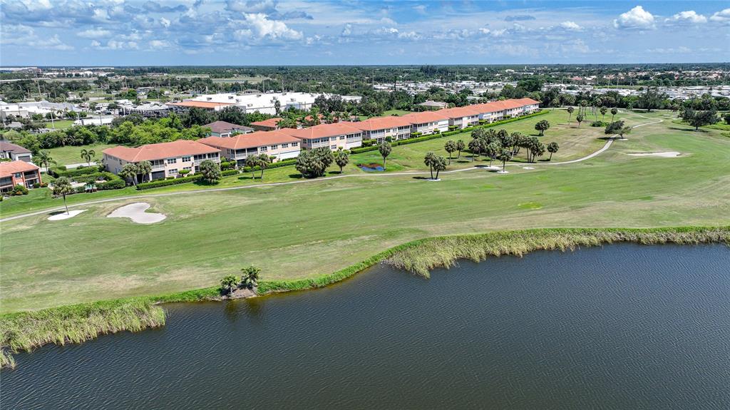 3959 San Rocco Court, Unit 911 Punta Gorda, FL 33950 - Photo 6 of 85 an aerial view of residential houses with outdoor space and lake view