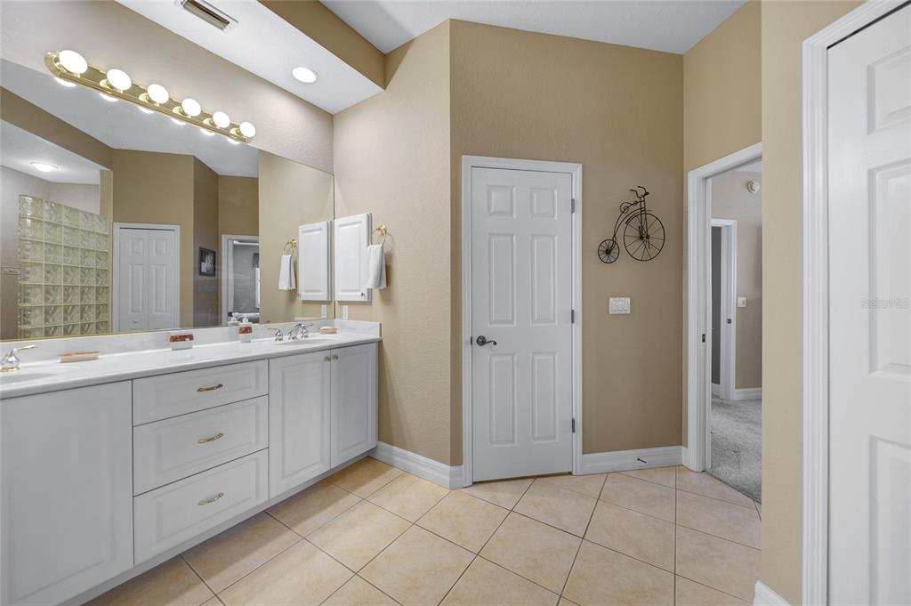 3959 San Rocco Court, Unit 911 Punta Gorda, FL 33950 - Photo 64 of 85 a spacious bathroom with a double vanity sink a mirror and a shower