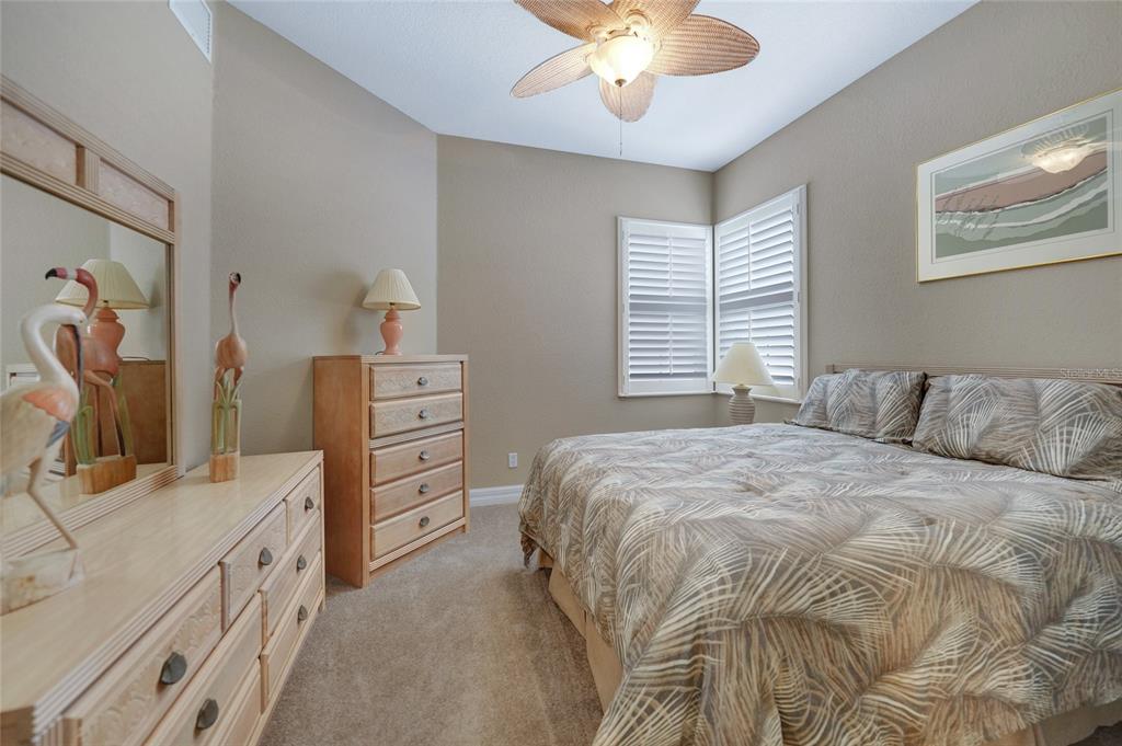 3959 San Rocco Court, Unit 911 Punta Gorda, FL 33950 - Photo 66 of 85 a bedroom with a bed and a chandelier