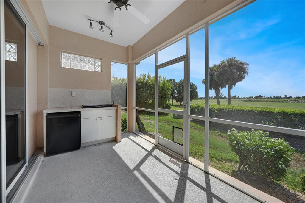 3959 San Rocco Court, Unit 911 Punta Gorda, FL 33950 - Photo 74 of 85 a view of a living room and a floor to ceiling window