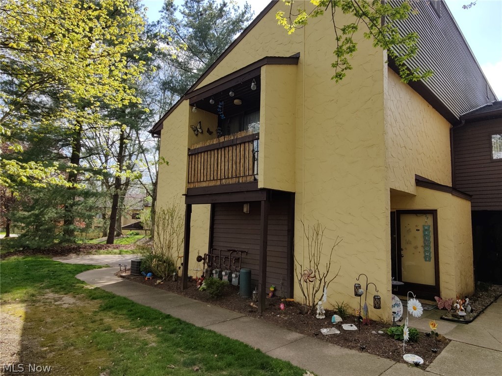View of property exterior with a balcony