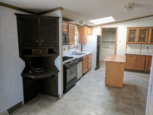 1728 K K 3/4 Road Fruita, CO 81521 - Photo 9 of 26 a kitchen with stainless steel appliances granite countertop a stove and a refrigerator